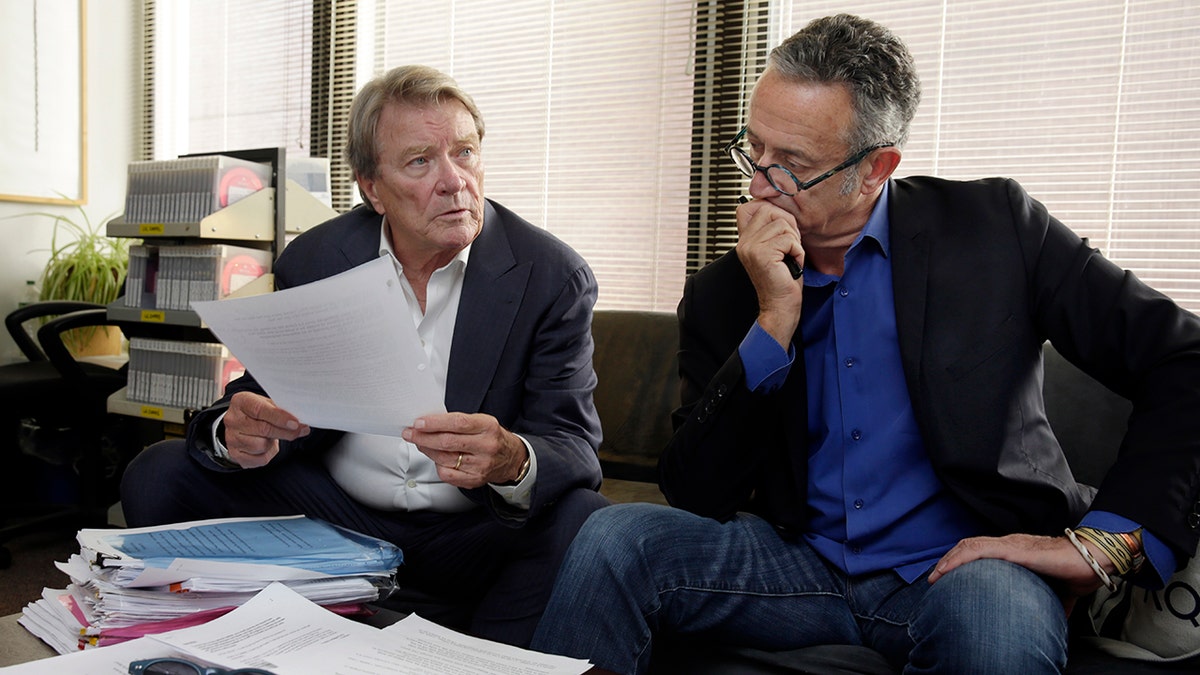 "60 Minutes" correspondent Steve Kroft, left, and producer Michael Gavshon, go over a script as they edit a segment for an upcoming show, in the "60 Minutes" offices, in New York, Tuesday, Sept. 12, 2017. (AP Photo/Richard Drew)
