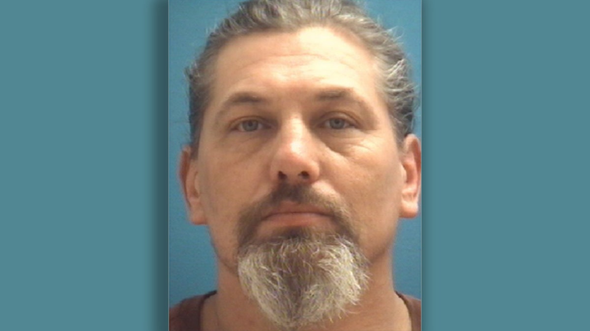 Aaron Allman, 48, was hauled off to jail on an outstanding warrant.