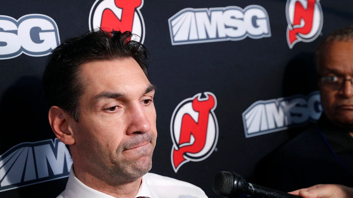 New Jersey Devils interim coach Alain Nasreddine speaks to the media before an NHL hockey game against the Vegas Golden Knights, Tuesday, Dec. 3, 2019, in Newark, N.J. Nasreddine was named interim head coach by Devils General Manager Ray Shero after the Devils fired head coach John Hynes earlier in the day. (AP Photo/Kathy Willens)