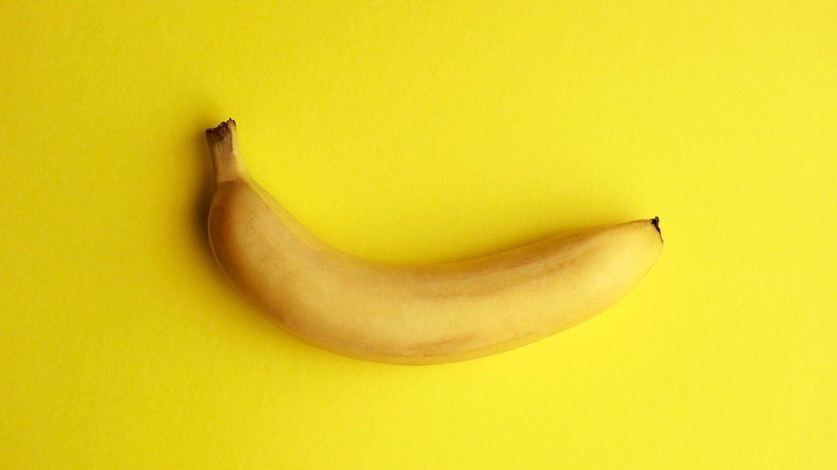 Photo of a banana on a yellow background