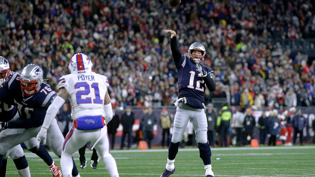 New England Patriots quarterback Tom Brady throws a touchdown pass to tight end Matt LaCosse in the first half of an NFL football game against the Buffalo Bills, Saturday, Dec. 21, 2019, in Foxborough, Mass.  (AP Photo/Steven Senne)