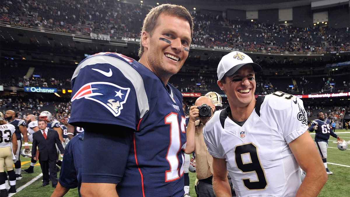 FILE - In this Aug. 22, 2015, file photo, New England Patriots quarterback Tom Brady (12) and New Orleans Saints quarterback Drew Brees (9) greet each other after an NFL preseason football game in New Orleans. (AP Photo/Bill Feig. File)