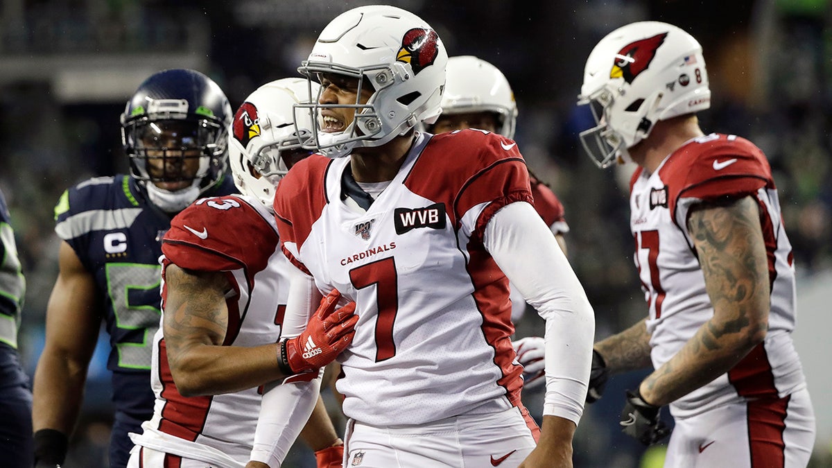 Arizona Cardinals quarterback Brett Hundley (7) reacts after making a 14-yard run on a keeper play during the second half of an NFL football game against the Seattle Seahawks, Sunday, Dec. 22, 2019, in Seattle. (AP Photo/Elaine Thompson)