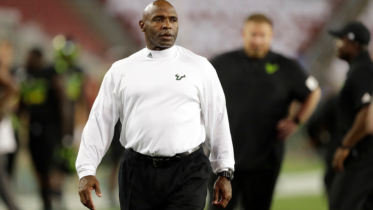 FILE - In this Nov. 7, 2019 file photo South Florida head coach Charlie Strong looks onto the field during the first half of an NCAA college football game against Temple in Tampa, Fla. South Florida has fired Strong as coach after three seasons. Athletic director Michael Kelly announced the move Sunday, Dec. 1, 2019 two days after the Bulls concluded a 4-8 season with a 34-7 loss at UCF. (AP Photo/Chris O'Meara, file)