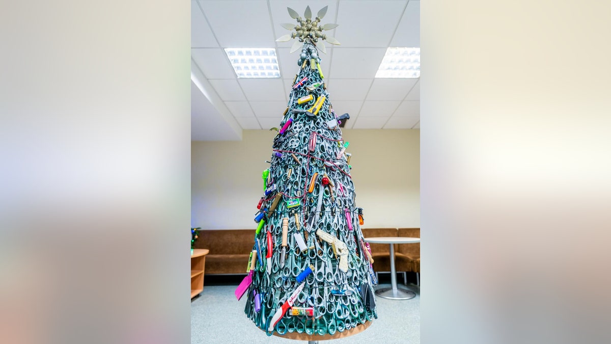 Vilnius Airport shared an image of the tree on LinkedIn, explaining that it was made exclusively using prohibited items that were taken from passengers’ carry-on luggage during security screening.