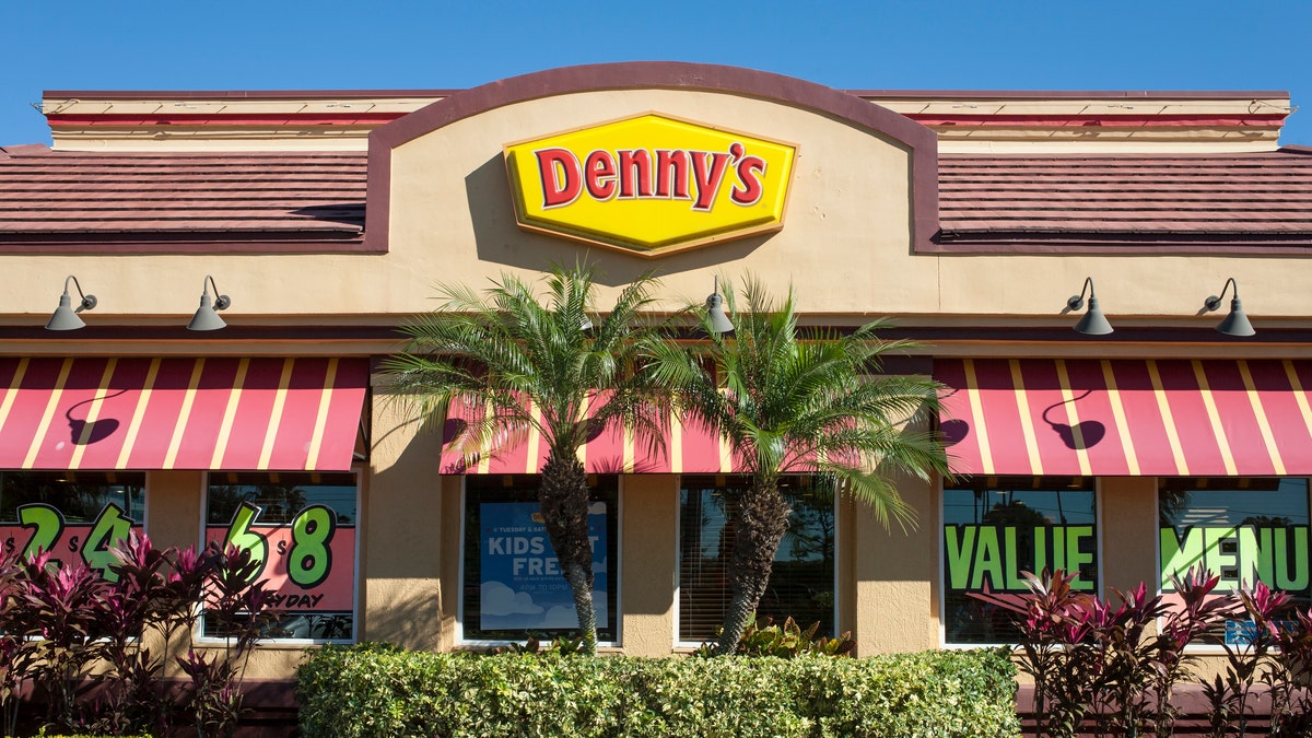 "Orlando, Florida, United States - December 22, 2012: A Denny's restaurant in Orlando, Florida -- various meal specials and advertisements are on display in the windows"