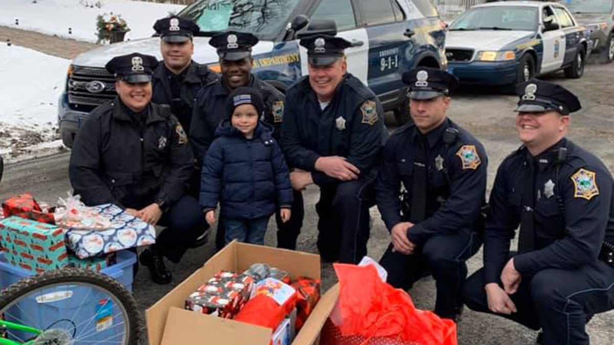 Massachusetts police officers wanted to help JJ have a special Christmas and celebrated by giving him presents, including a bicycle, on Sunday. 