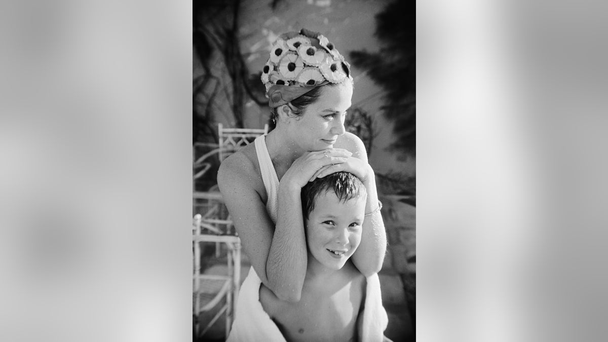 Princess Grace of Kelly relaxing with Prince Albert, then 9.