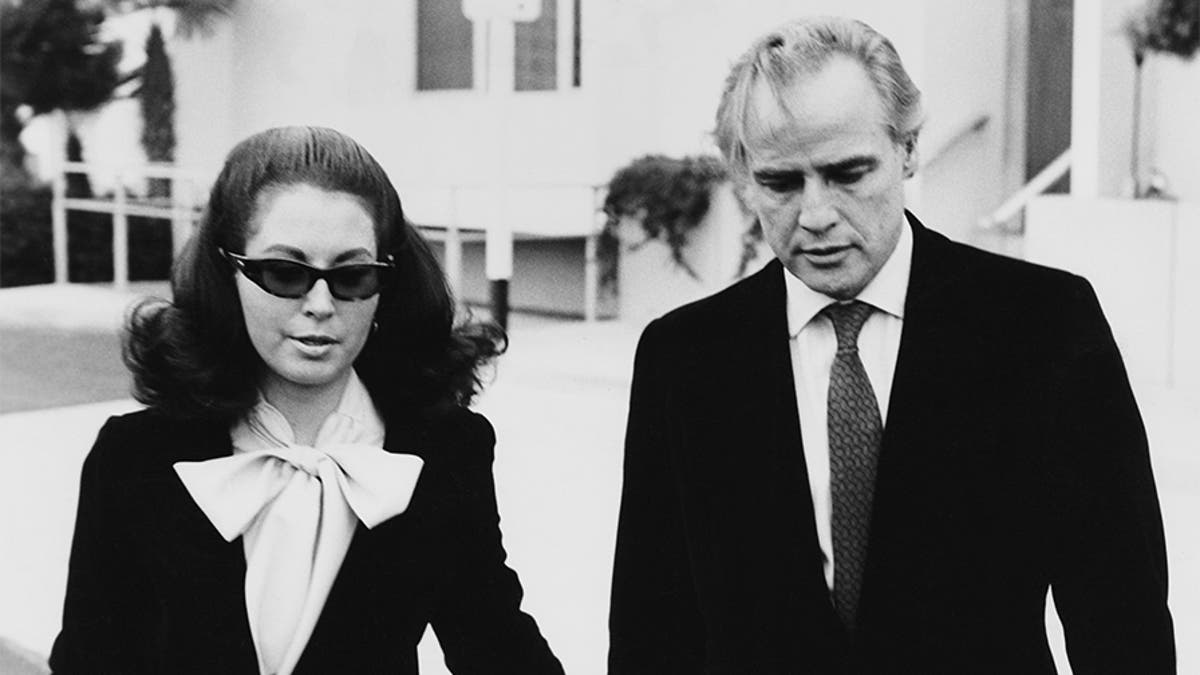 American actor Marlon Brando (1924 - 2004) leaves the Santa Monica courthouse with his attorney Judy Gilbert, during a legal battle with his wife, Anna Kashfi for custody of their son Christopher, 13th March 1972.