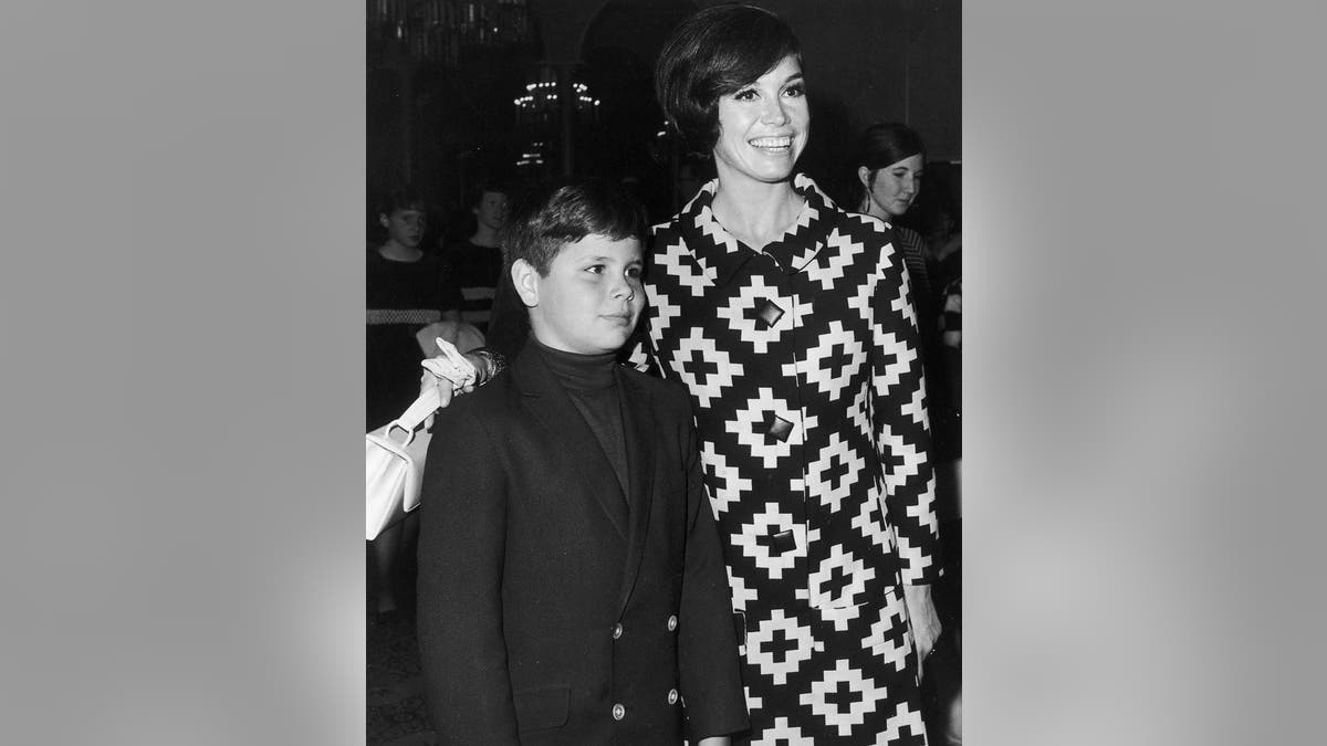 Mary Tyler Moore puts her arm around her son, Richard Meeker Jr.
