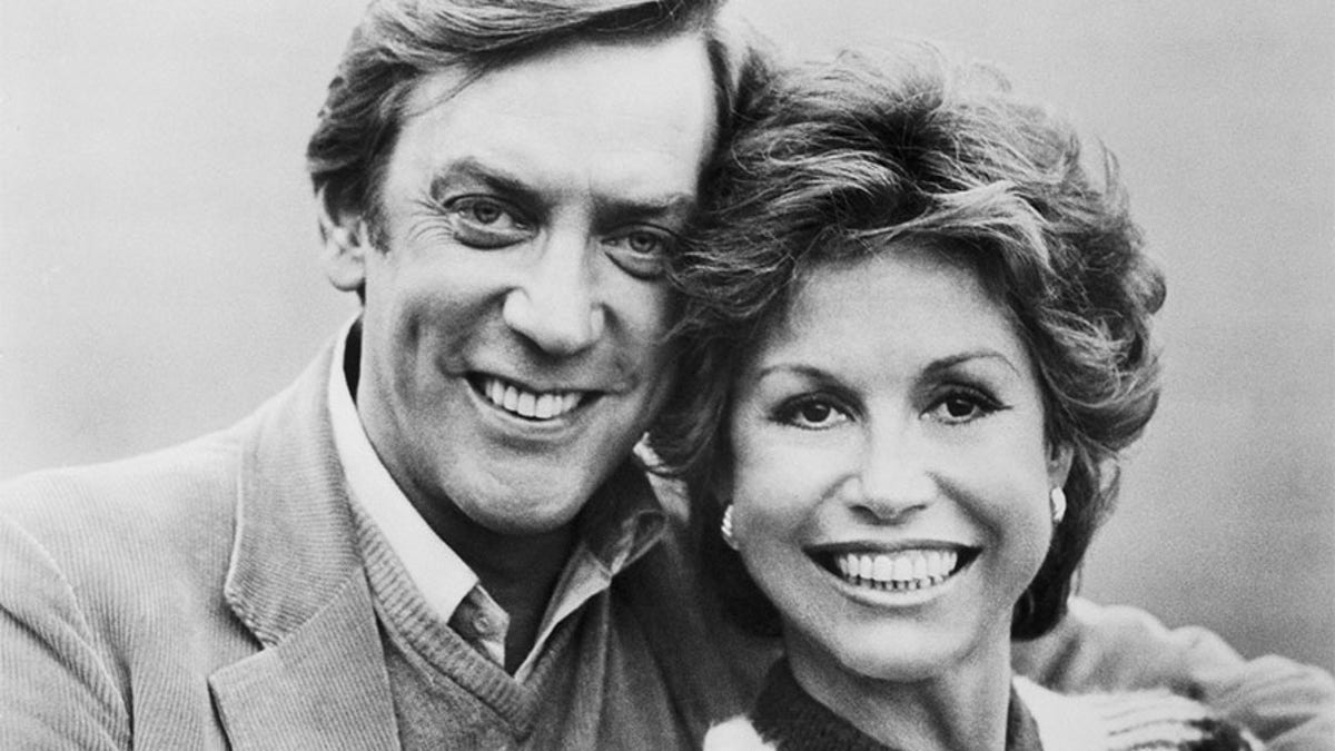 Donald Sutherland and Mary Tyler Moore are shown in a scene from their movie, "Ordinary People" directed by Robert Redford and released by Paramount Pictures. Sutherland and Moore's characters attempt to pick up the pieces of their shattered life after a major tragedy by planning a holiday trip to London. 