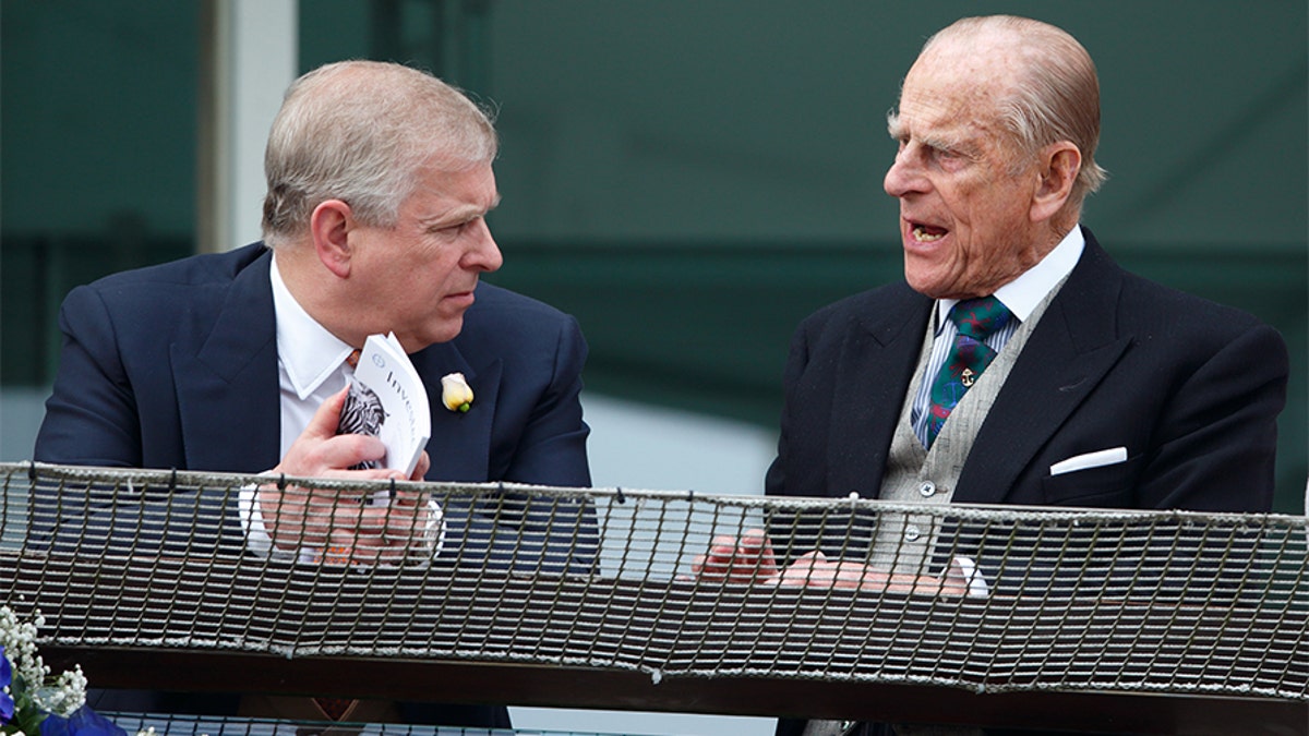  Prince Philip, Duke of Edinburgh and Prince Andrew, Duke of York watch the racing from the balcony of the Royal Box as they attend Derby Day during the Investec Derby Festival at Epsom Racecourse on June 4, 2016 in Epsom, England.