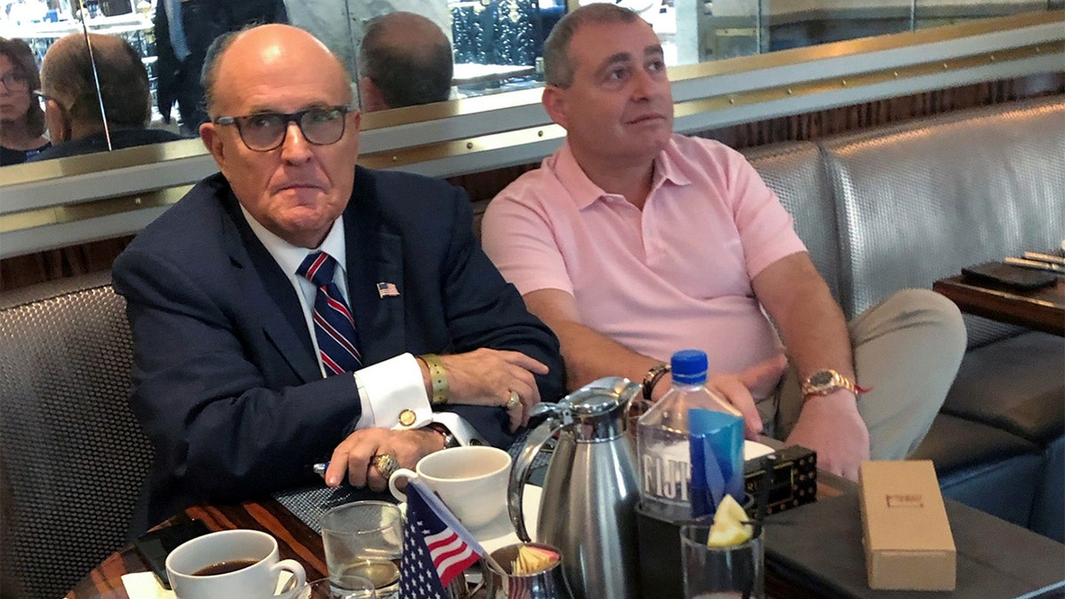 U.S. President Trump's personal lawyer Rudy Giuliani has coffee with Ukrainian-American businessman Lev Parnas at the Trump International Hotel in Washington, D.C., on Sept. 20, 2019. REUTERS/Aram Roston 