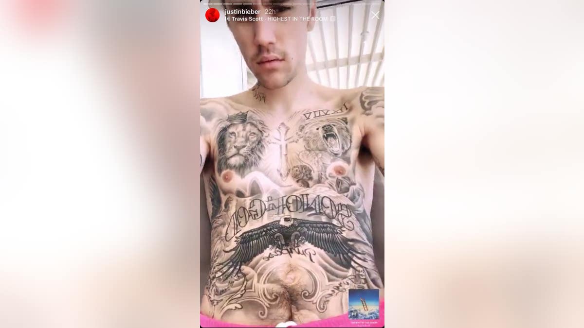Bieber's tattoo-covered midsection, featuring a "Son of God" tattoo across his stomach.