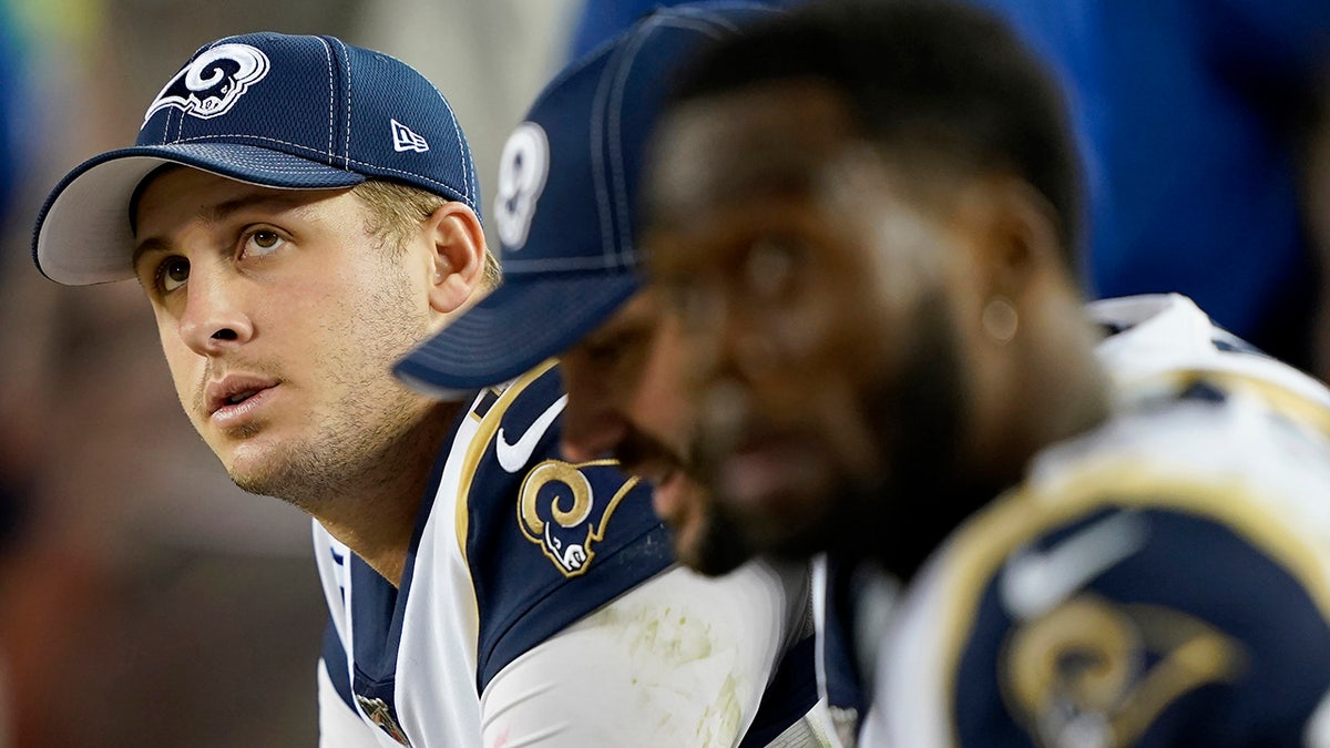 Los Angeles Rams quarterback Jared Goff, left, sits on the bench with teammates during the second half of the team's NFL football game against the San Francisco 49ers in Santa Clara, Calif., Saturday, Dec. 21, 2019. (AP Photo/Tony Avelar)