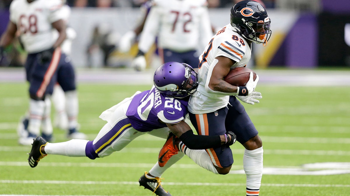 Chicago Bears wide receiver Javon Wims, right, tries to break a tackle by Minnesota Vikings cornerback Mackensie Alexander, left, after catching a pass during the first half of an NFL football game, Sunday, Dec. 29, 2019, in Minneapolis. (AP Photo/Andy Clayton-King)