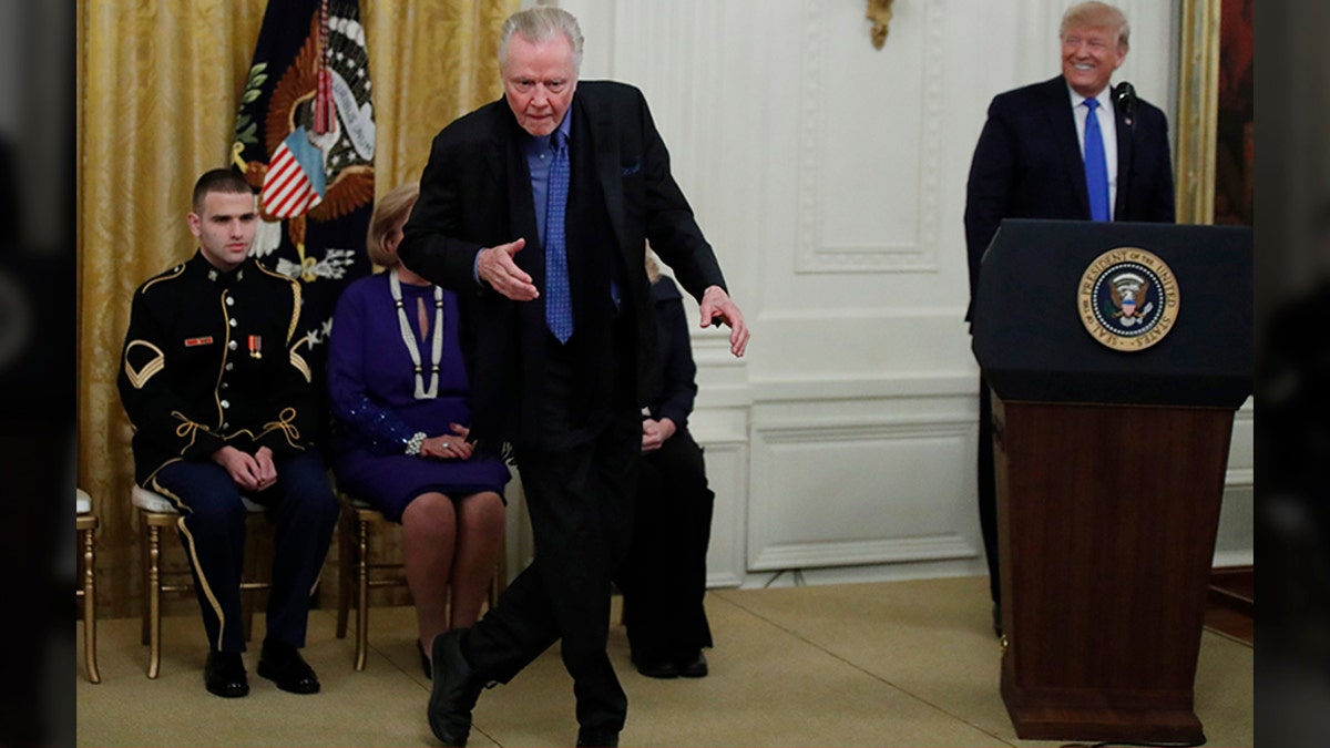 Jon Voight dances as President Donald Trump looks on during a National Medal of Arts and National Humanities Medal ceremony in the East Room of the White House, Thursday, Nov. 21, 2019, in Washington. (AP Photo/Alex Brandon)