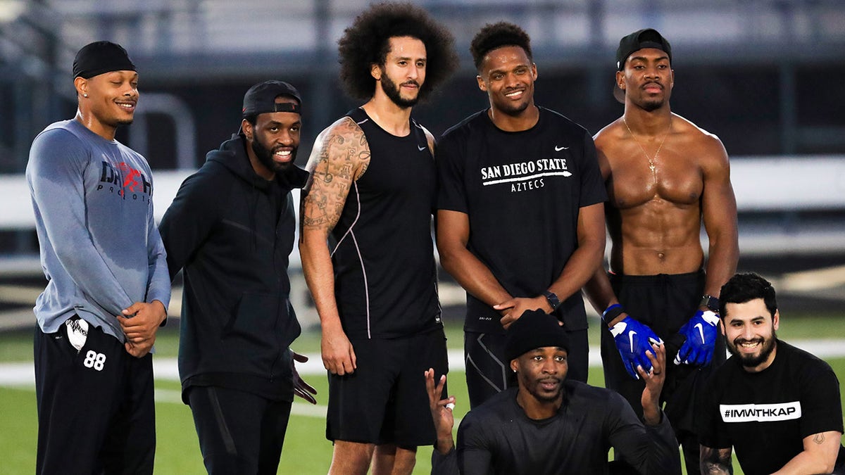 Colin Kaepernick stands with Bruce Ellington, Brice Butler, Jordan Veasy, and Ari Werts during the Colin Kaepernick NFL workout held at Charles R. Drew High School on November 16, 2019 in Riverdale, Georgia. (Photo by Carmen Mandato/Getty Images)