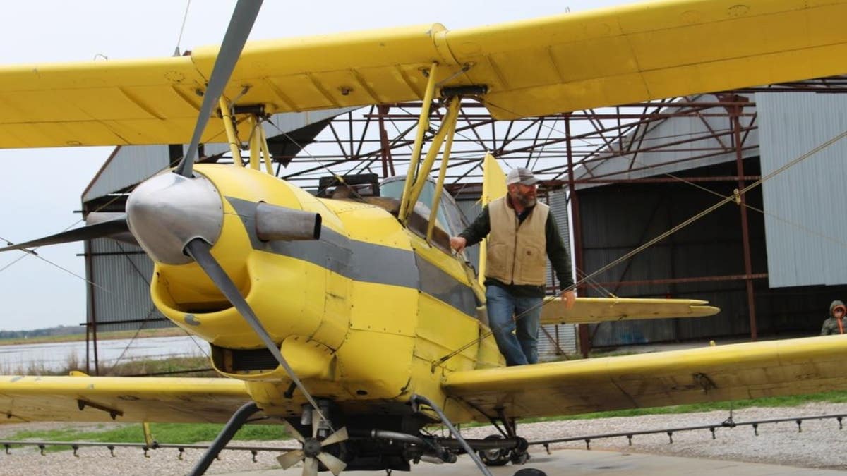 A crop duster was loaded with 100 gallons of holy water to be sprayed onto the town of Cow Island, La., and nearby farms. 