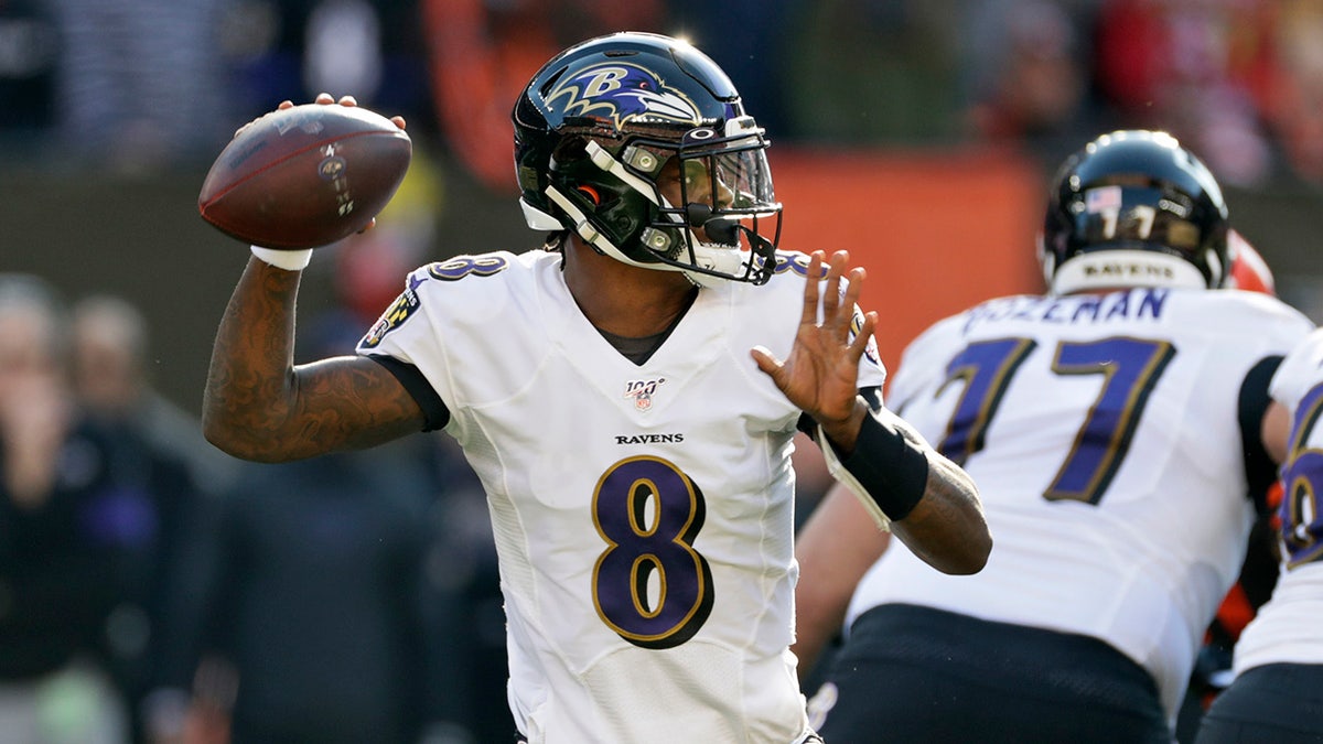 Baltimore Ravens quarterback Lamar Jackson looks to throw against the Cleveland Browns during the first half of an NFL football game, Sunday, Dec. 22, 2019, in Cleveland. (AP Photo/Ron Schwane)