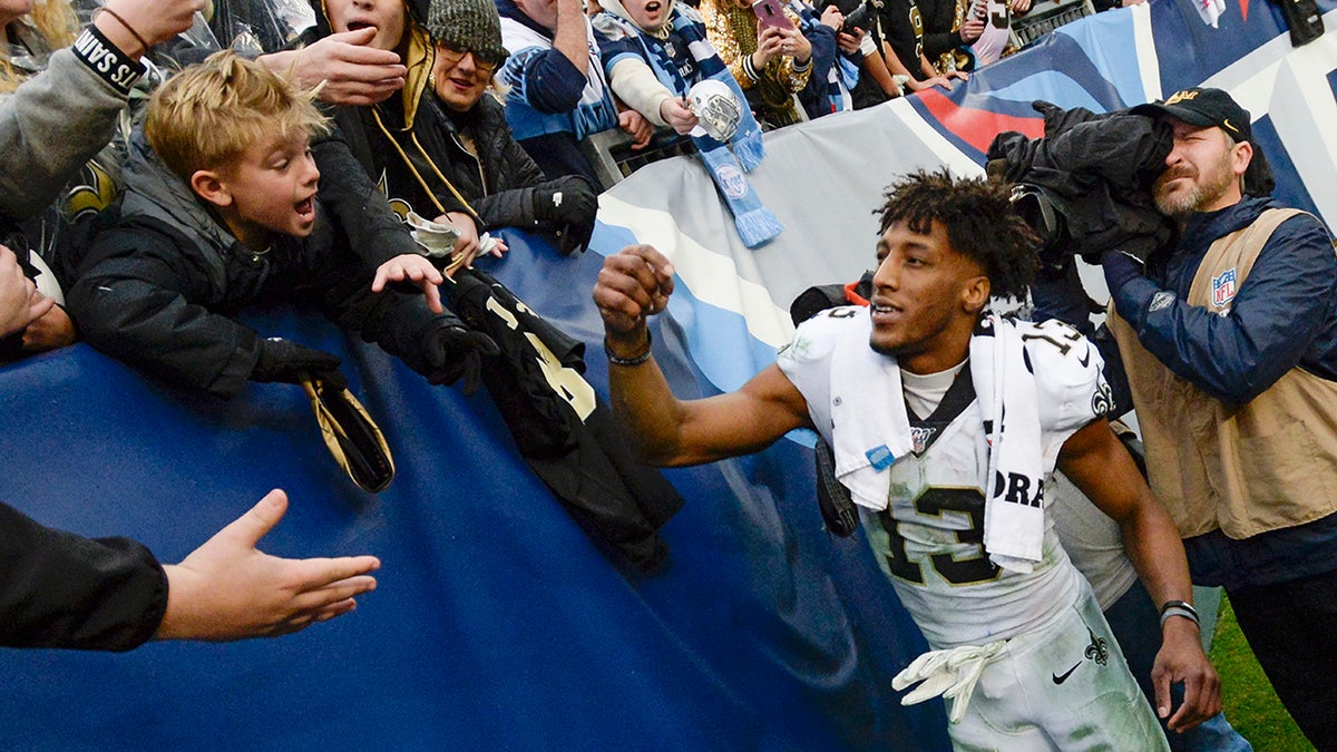 New Orleans Saints wide receiver Michael Thomas signs autographs after an NFL football game against the Tennessee Titans Sunday, Dec. 22, 2019, in Nashville, Tenn. The Saints won 38-28.