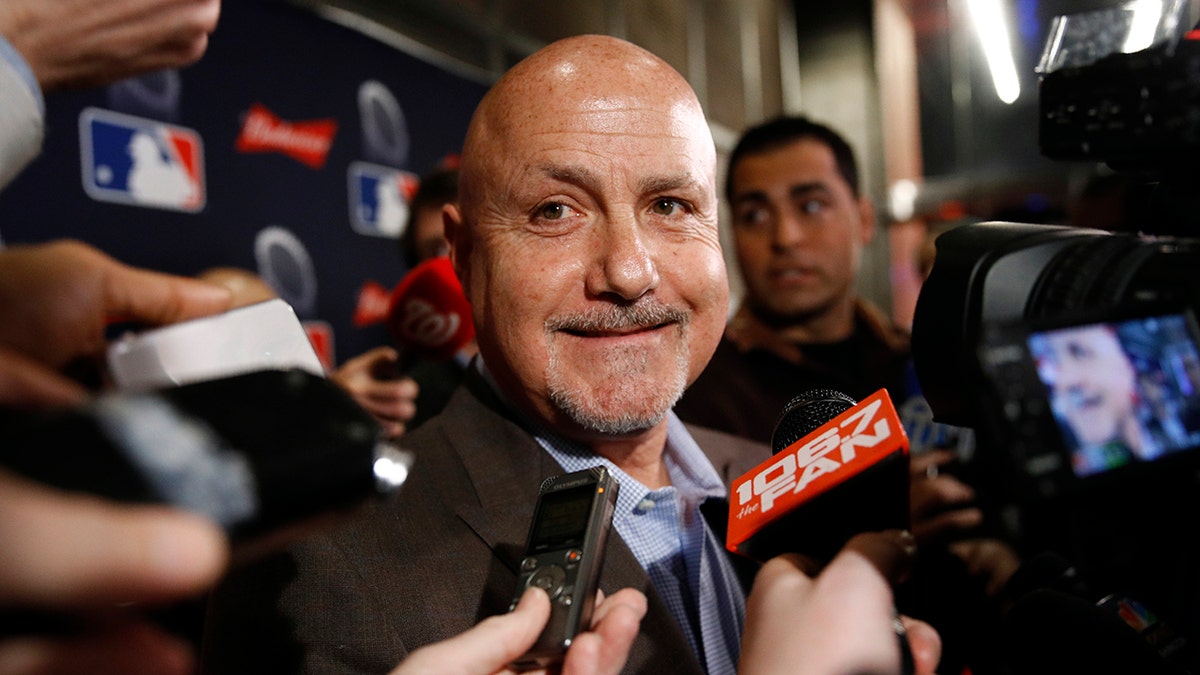Washington Nationals general manager Mike Rizzo speaks with members of the media as he arrives for the premiere of a documentary film on the team's first World Series baseball championship, Monday, Dec. 2, 2019, in Washington. (AP Photo/Patrick Semansky)