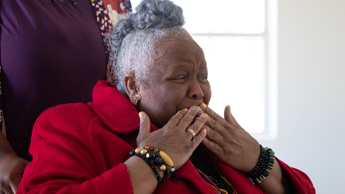 Earnestine Reese reacts to her new home that was rebuilt by Samaritan's Purse after it was destroyed in March by two tornadoes.