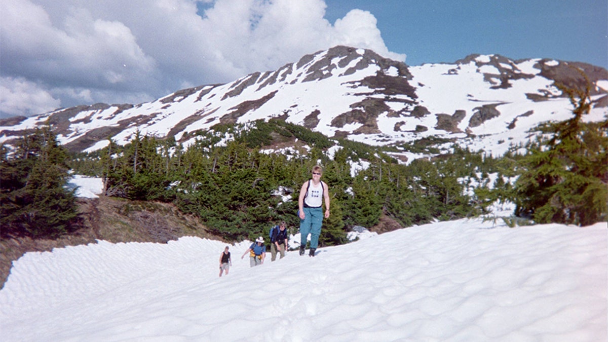 Kristin Snyder and friends hiking on a mountain.