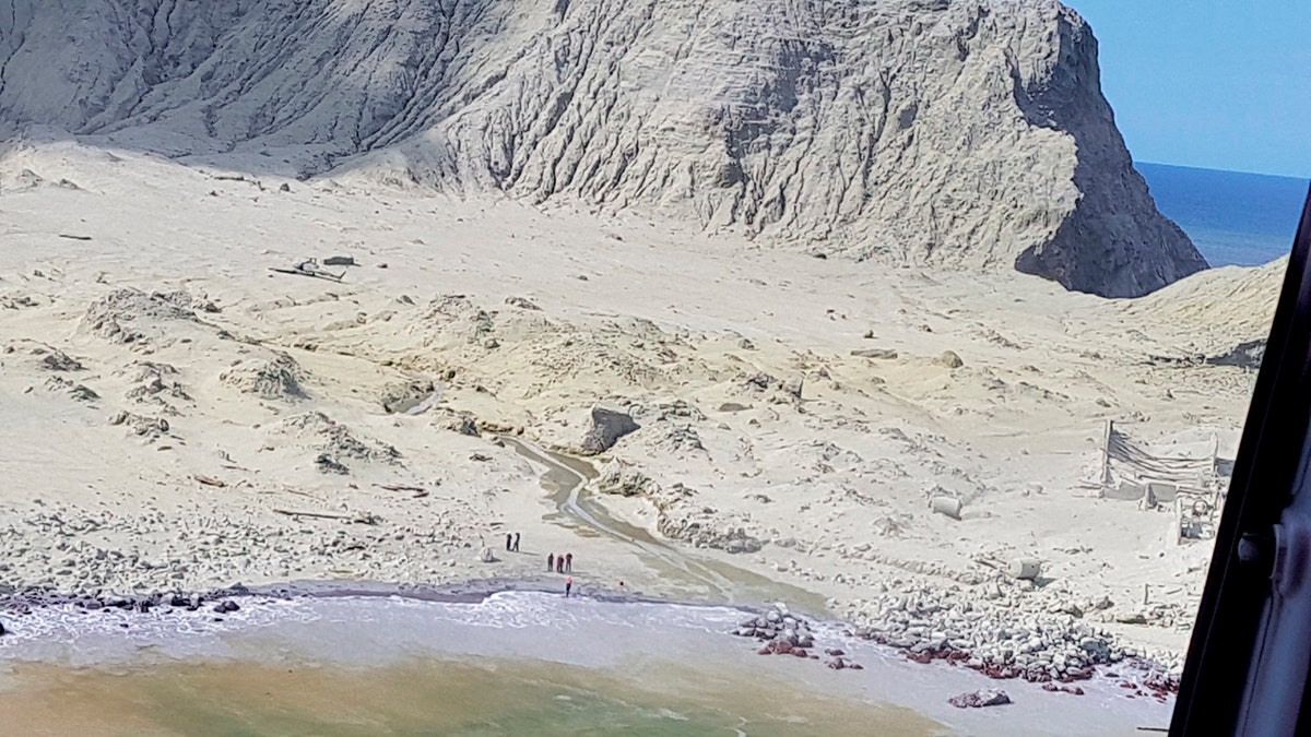 This Dec. 9, 2019, photo provided by Auckland Rescue Helicopter Trust shows ash-covered White Island, New Zealand, following the eruption of the volcano.