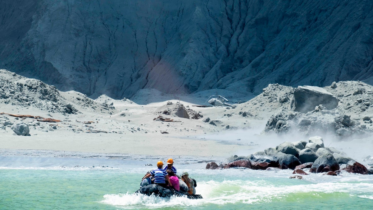 This Monday, Dec. 9, 2019, photo provided by Michael Schade shows the rescuers' boat leaving White Island following the eruption of the volcano, New Zealand. Michael Schade via AP