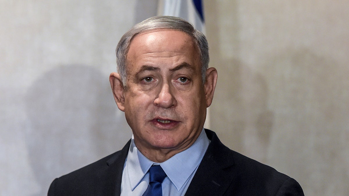 Israeli’s prime minister said Wednesday that he will seek parliamentary immunity from prosecution in the corruption charges against him, which could delay his trial until after the elections. (Patricia de Melo Moreira/Pool via REUTERS)