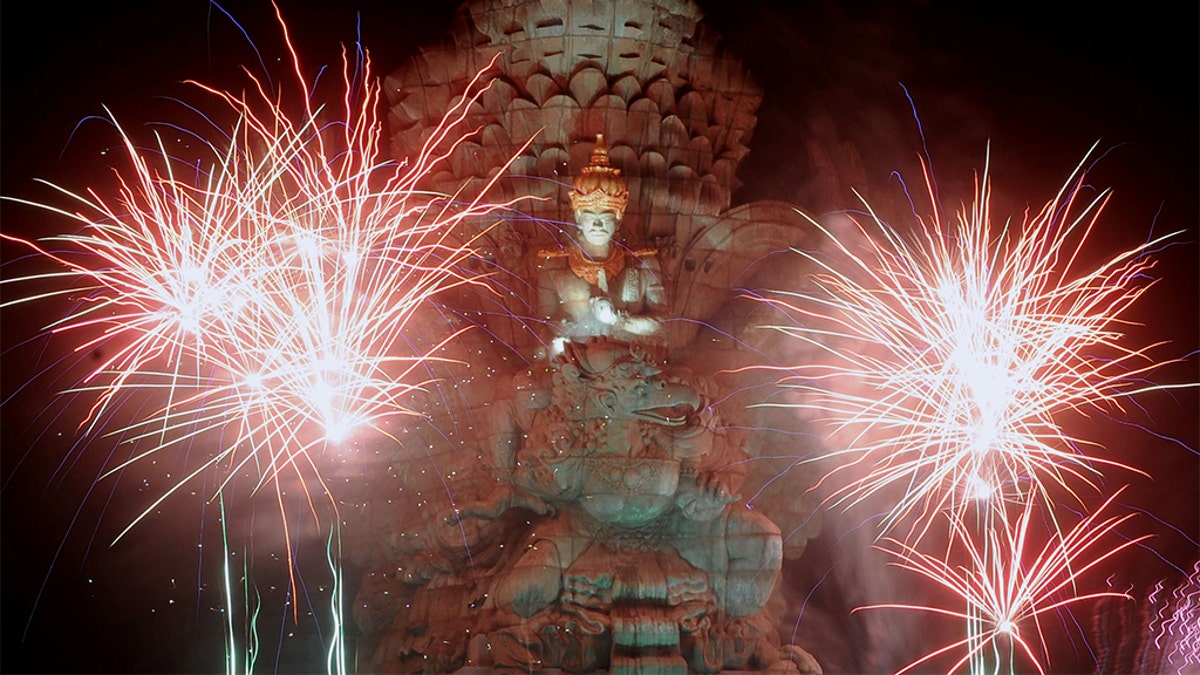 Fireworks explode over Garuda Wisnu Kencana statue during New Year's celebrations in Bali, Indonesia, Jan. 1, 2020. (Reuters) 