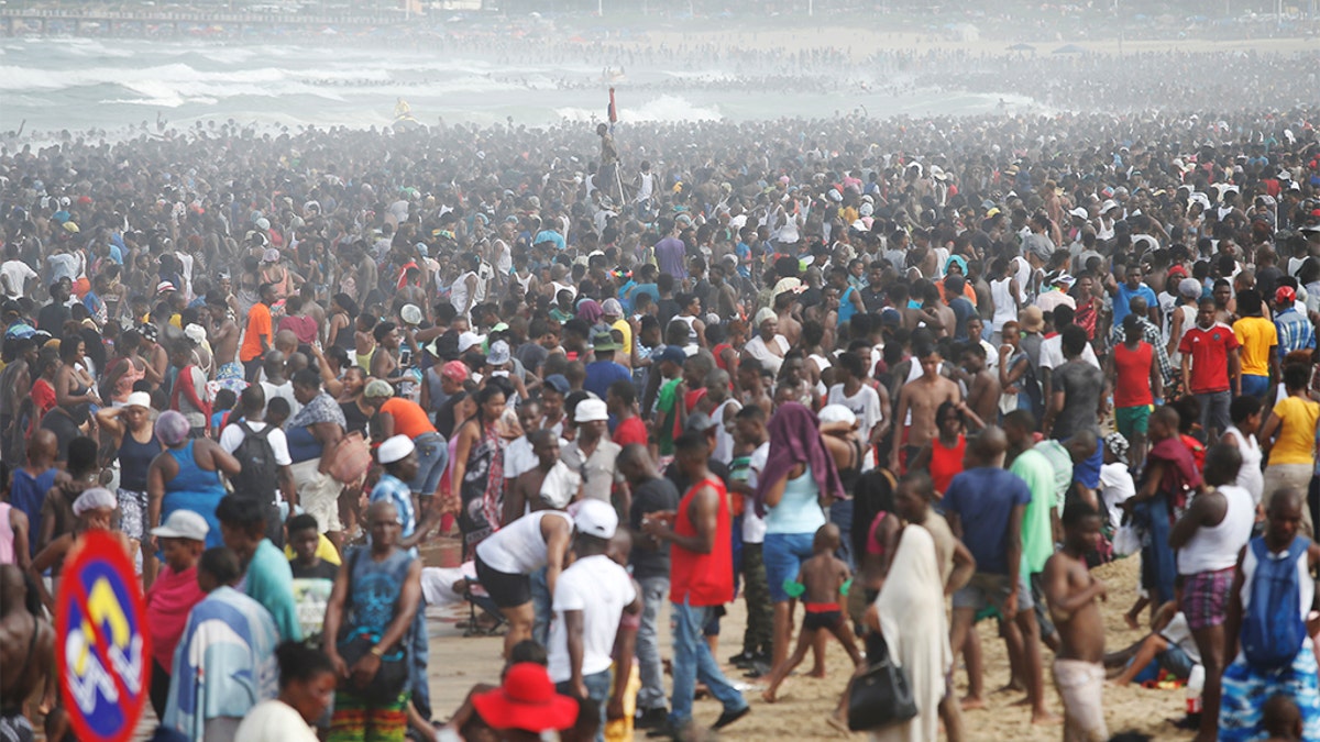 Revellers enjoy New Year's Day on a beach in Durban, South Africa January 1, 2017. (Reuters) 