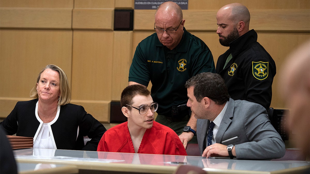 Nikolas Cruz with attorney Gabe Ermine in Judge Elizabeth Scherer's courtroom at the Broward County Courthouse on Dec. 19 in Fort Lauderdale, Fla. (Michael Laughlin/South Florida Sun-Sentinel via AP, Pool)