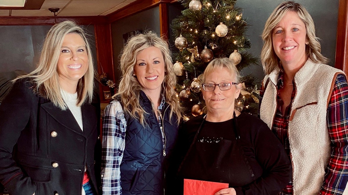 Jessica Greb (center left), the founder of Orchestrating Good, told Fox News that she and others gave a $1,300 tip to waitress Michele Bachmann (center right).