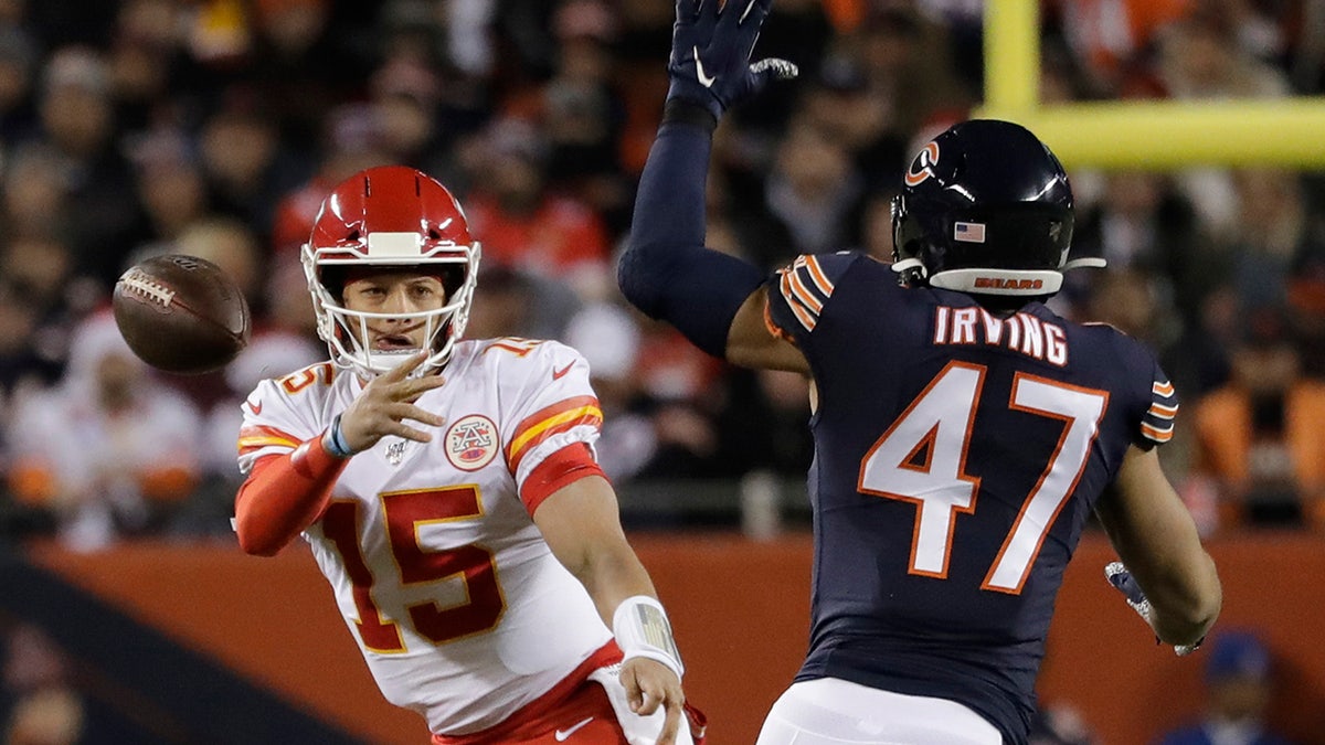 Kansas City Chiefs quarterback Patrick Mahomes (15) throws as Chicago Bears linebacker Isaiah Irving (47) tries to deflect the ball in the first half of an NFL football game in Chicago, Sunday, Dec. 22, 2019. (AP Photo/Nam Y. Huh)