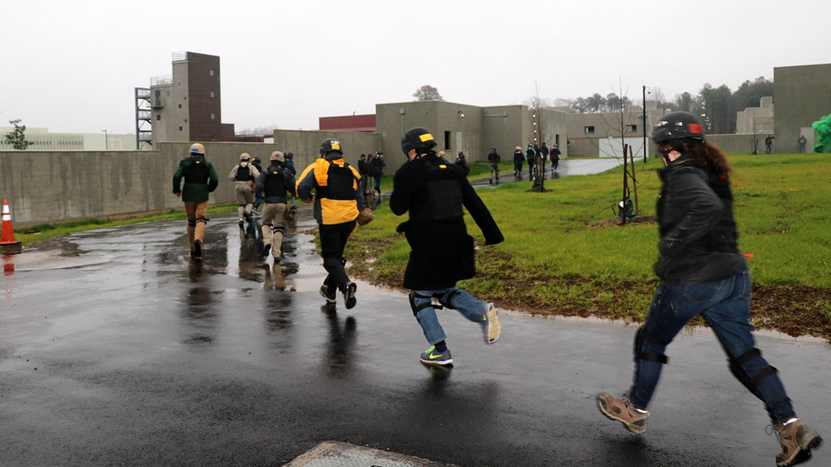 People running during a drill at the Foreign Affairs Security Training Center in Blackstone, Virginia. The newly-opened center is designed to train overseas workers how to respond to security threats and embassy attacks. (Fox News)