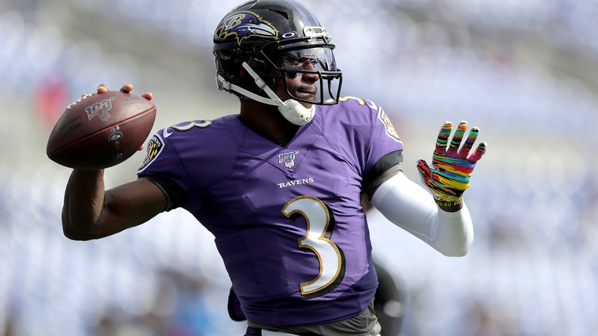 FILE - In this Oct. 13, 2019, file photo Baltimore Ravens quarterback Robert Griffin III works out prior to an NFL football game against the Cincinnati Bengals in Baltimore.