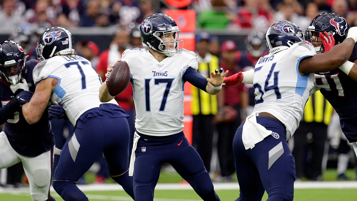 Tennessee Titans quarterback Ryan Tannehill (17) looks to throw a pass against the Houston Texans during the first half of an NFL football game Sunday, Dec. 29, 2019, in Houston. (AP Photo/Michael Wyke)