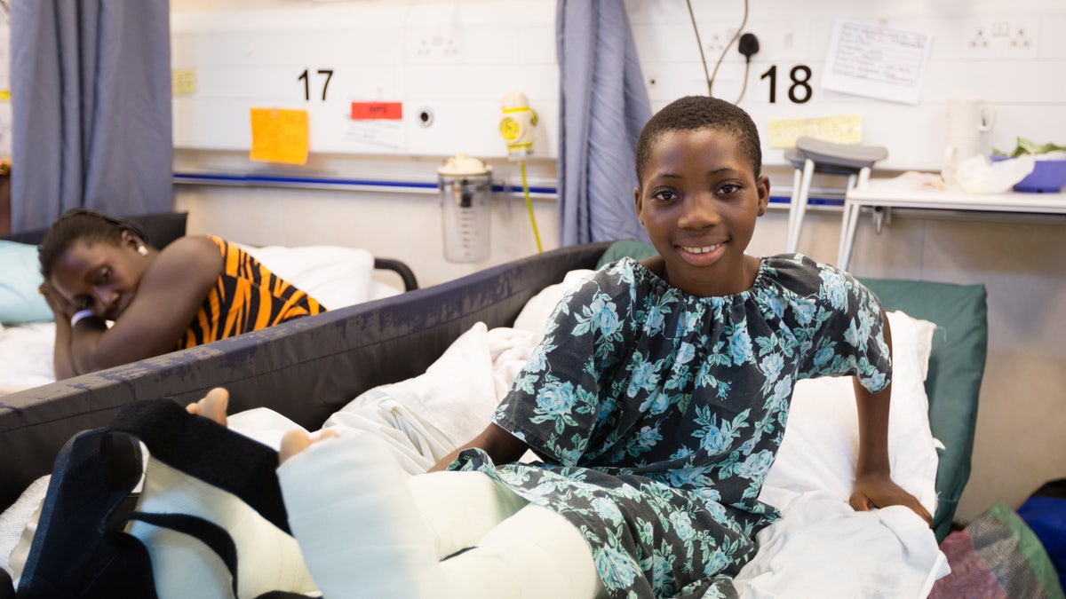 Valerie, pictured recovering after her surgery which took place on board Africa Mercy, said she is excited to see her old classmates again. 