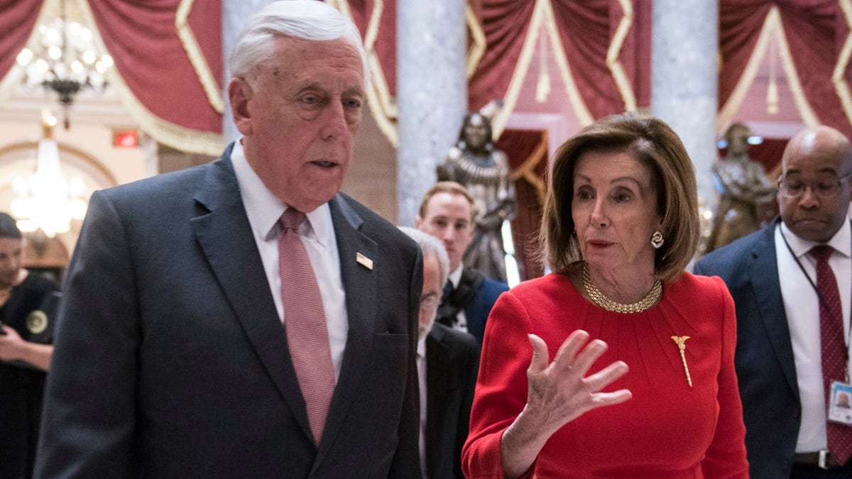 House Majority Leader Rep. Steny Hoyer (D-MD) and House Speaker Nancy Pelosi (D-CA) walk from the House floor (Photo by Sarah Silbiger/Getty Images)