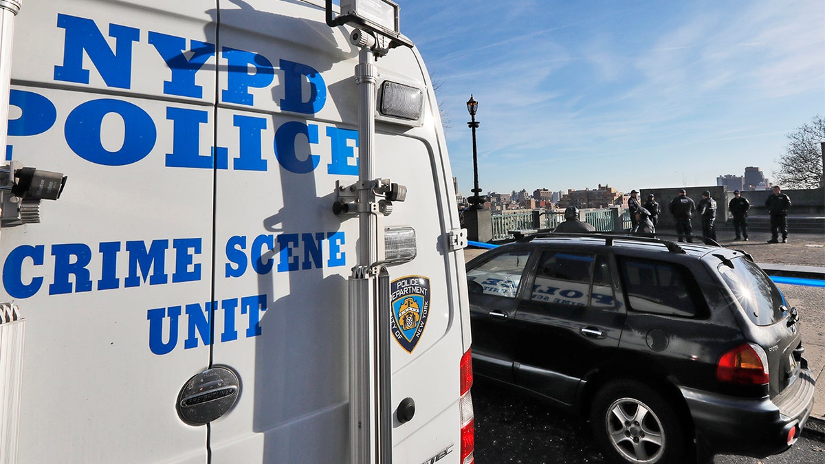 A New York City Police Dept. Crime Scene Unit and officers assemble at an entrance to Morningside Park along Manhattan's Upper West Side, on Dec. 12, 2019, in New York. An 18-year-old Barnard College freshman, identified as Tessa Majors, was fatally stabbed in the park, sending shock waves through the college and wider Columbia University community. (AP Photo/Richard Drew)