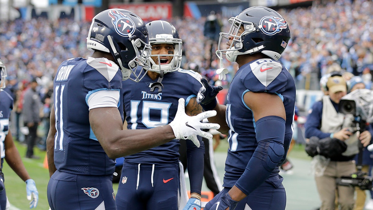 Tennessee Titans tight end Jonnu Smith, right, is congratulated after scoring at touchdown against the New Orleans Saints in the first half of an NFL football game Sunday, Dec. 22, 2019, in Nashville, Tenn. (AP Photo/James Kenney)