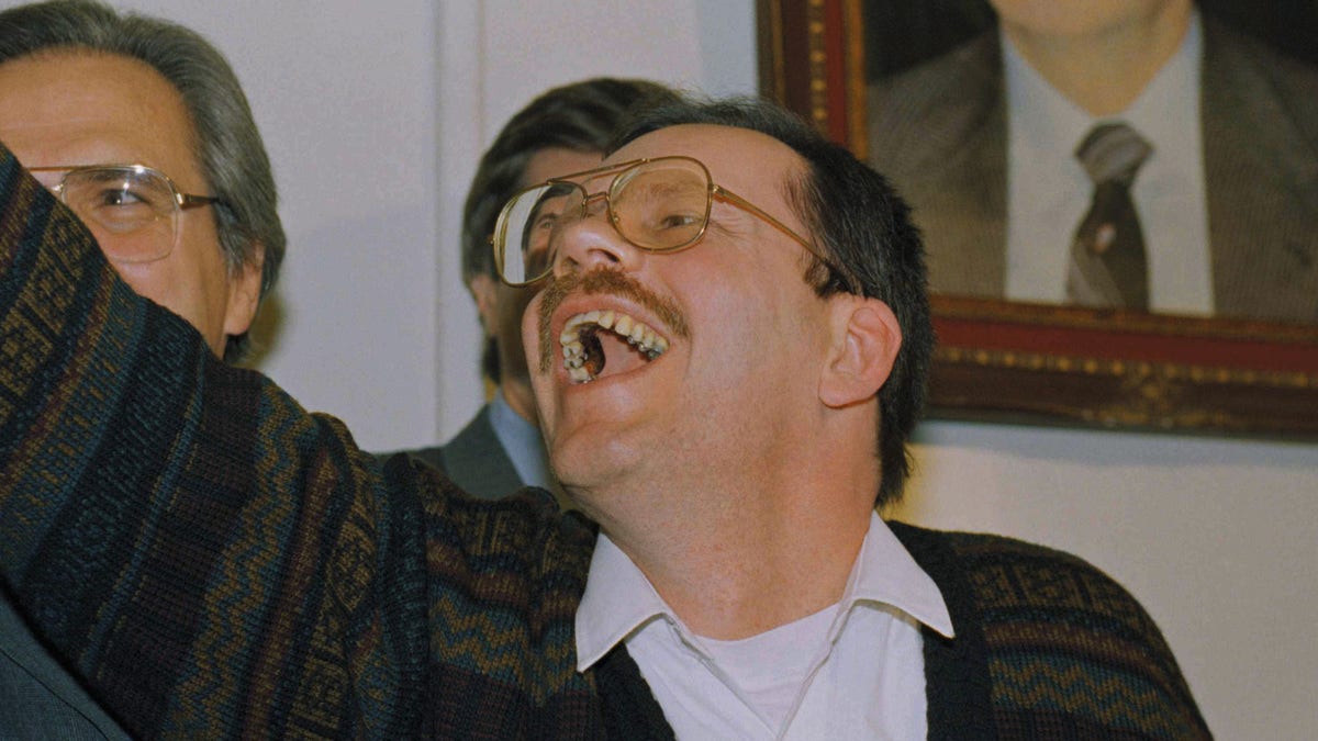 Terry Anderson, chief Middle East correspondent for the Associated Press, waves as he enters a news conference in the Syrian Foreign Ministry in Damascus, Wednesday, Dec. 4, 1991. Anderson was held captive for nearly seven years before being released on Wednesday. (AP Photo/Santiago Lyon)