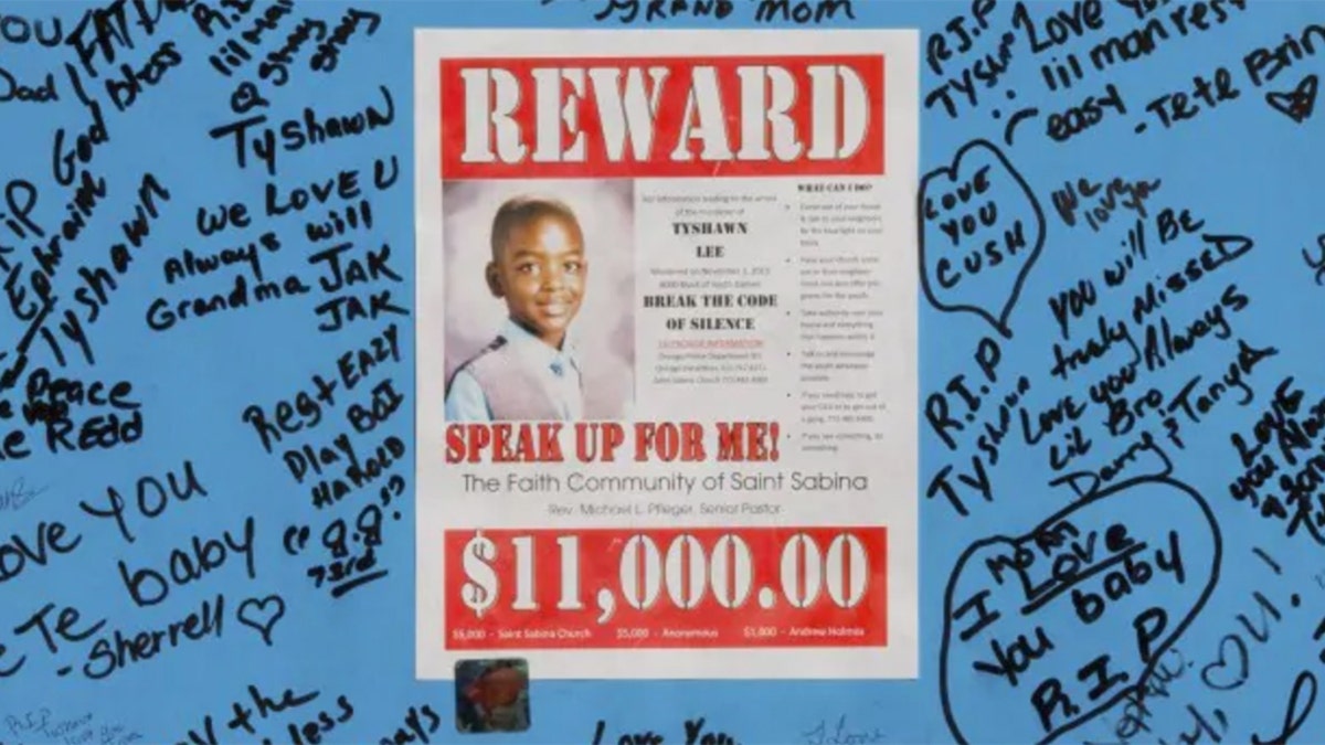 A reward sign and messages hang in November 2015, near where Tyshawn Lee was fatally shot in Chicago.