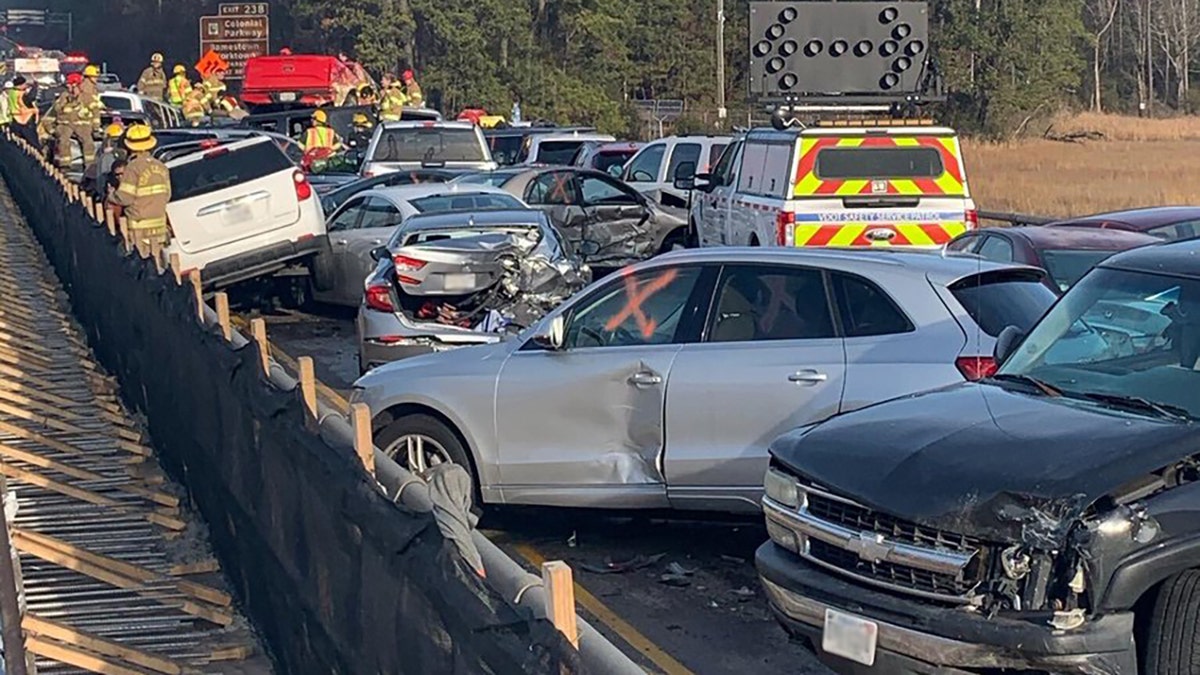 The congestion was so tight that some vehicles had been raised off the road by other cars that were pushed underneath their frames.