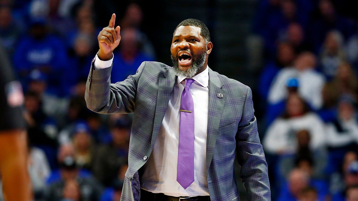 Evansville coach Walter McCarty shouts during the second half of the team's NCAA college basketball game against Kentucky in Lexington, Ky., Tuesday, Nov. 12, 2019. Evansville won 67-64. (AP Photo/James Crisp)