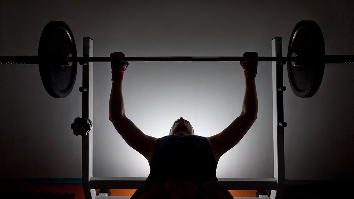 Man weightlifter at the gym