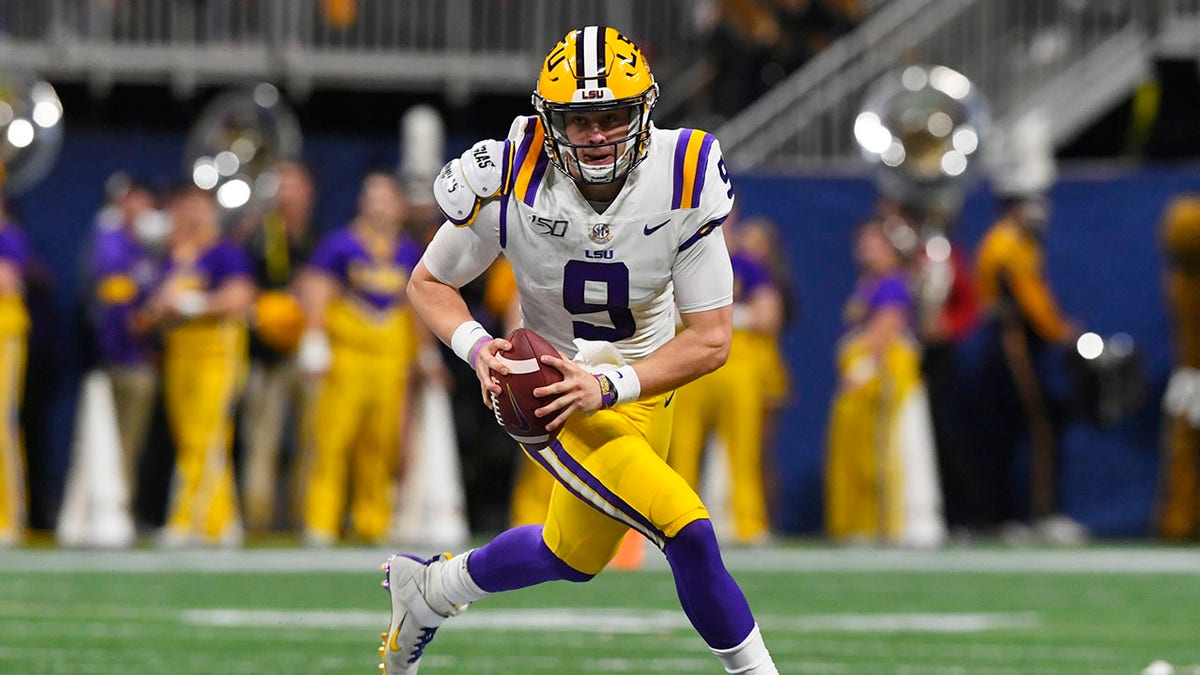 LSU quarterback Joe Burrow (9) runs down field against Georgia during the first half of the Southeastern Conference championship NCAA college football game, Saturday, Dec. 7, 2019, in Atlanta. (Associated Press)