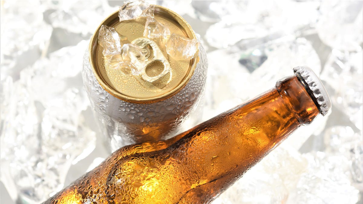 beer bottle and can chilled in ice